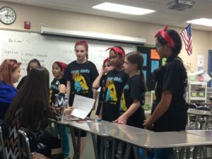 The GearGirls discuss FLL core values with the judges.